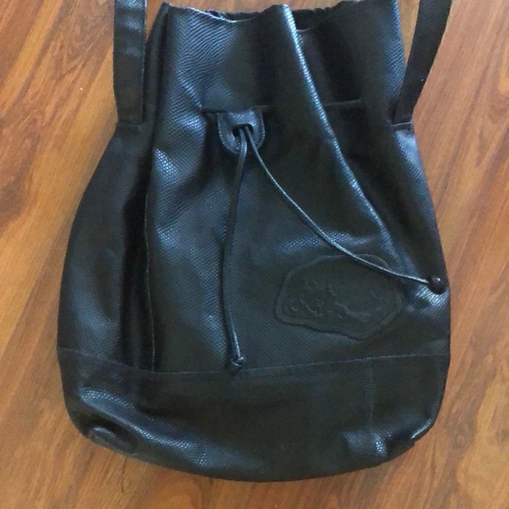 Carlos Falchi Black leather drawstring Crossbody bag.